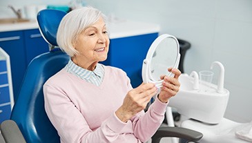 Woman smiling in the dental chair